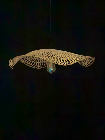 Woven pendant light fixture on a dark background